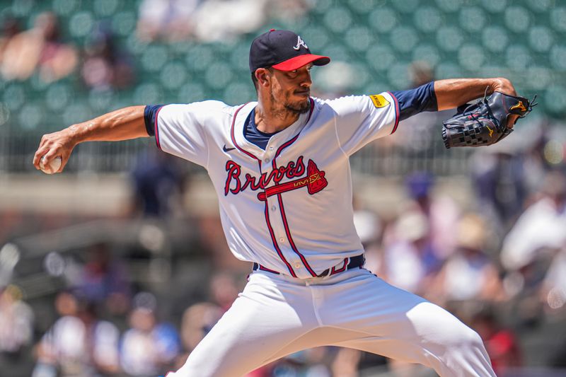 Aug 8, 2024; Cumberland, Georgia, USA; Atlanta Braves starting pitcher Charlie Morton (50) pitches against the Milwaukee Brewers during the second inning at Truist Park. Mandatory Credit: Dale Zanine-USA TODAY Sports