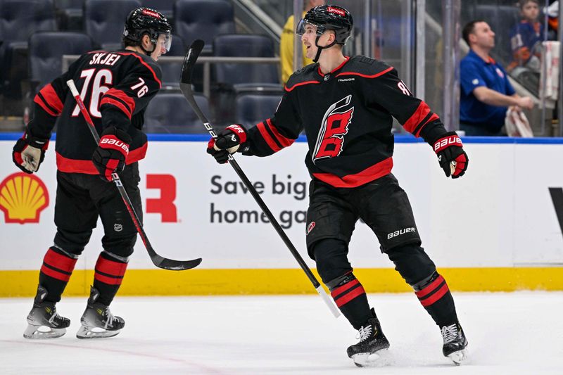 Mar 19, 2024; Elmont, New York, USA; Carolina Hurricanes center Martin Necas (88) celebrates his goal against the New York Islanders during the first period at UBS Arena. Mandatory Credit: Dennis Schneidler-USA TODAY Sports