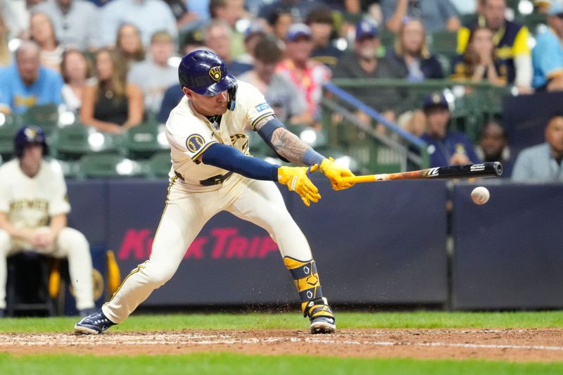 Aug 13, 2024; Milwaukee, Wisconsin, USA;  Milwaukee Brewers third baseman Joey Ortiz (3) drives in a run during the seventh inning against the Los Angeles Dodgers at American Family Field. Mandatory Credit: Jeff Hanisch-USA TODAY Sports