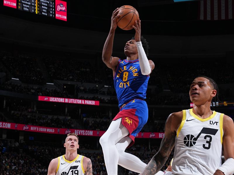 DENVER, CO - MARCH 9: Peyton Watson #8 of the Denver Nuggets drives to the basket during the game against the Utah Jazz on March 9, 2024 at the Ball Arena in Denver, Colorado. NOTE TO USER: User expressly acknowledges and agrees that, by downloading and/or using this Photograph, user is consenting to the terms and conditions of the Getty Images License Agreement. Mandatory Copyright Notice: Copyright 2024 NBAE (Photo by Garrett Ellwood/NBAE via Getty Images)