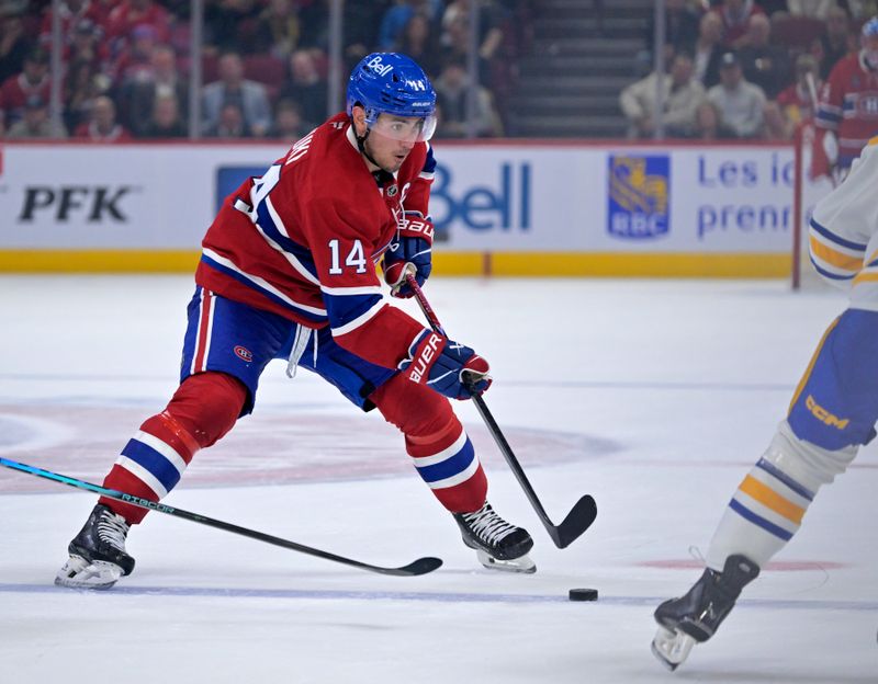 Oct 20, 2025; Montreal, Quebec, CAN; Montreal Canadiens forward Nick Suzuki (14) plays the puck during the third period of the game against the Buffalo Sabres at the Bell Centre. Mandatory Credit: Eric Bolte-Imagn Images