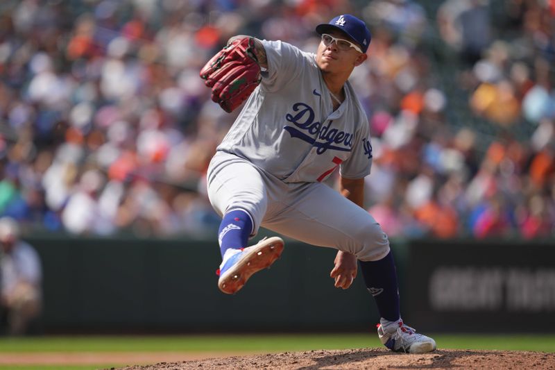 Jul 19, 2023; Baltimore, Maryland, USA; Los Angeles Dodgers pitcher Julio Urias (7) delivers in the sixth inning against the Baltimore Orioles at Oriole Park at Camden Yards. Mandatory Credit: Mitch Stringer-USA TODAY Sports