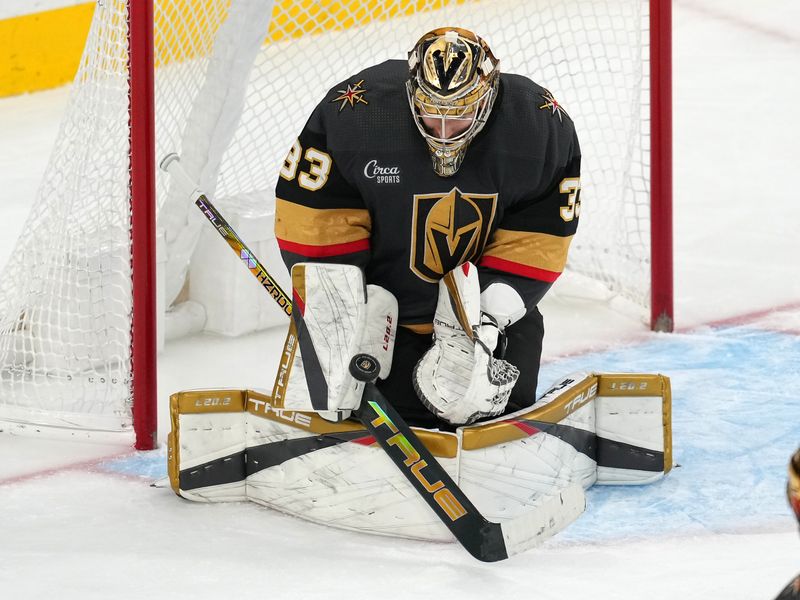 Jan 19, 2023; Las Vegas, Nevada, USA; Vegas Golden Knights goaltender Adin Hill (33) makes a save against the Detroit Red Wings during the third period at T-Mobile Arena. Mandatory Credit: Stephen R. Sylvanie-USA TODAY Sports