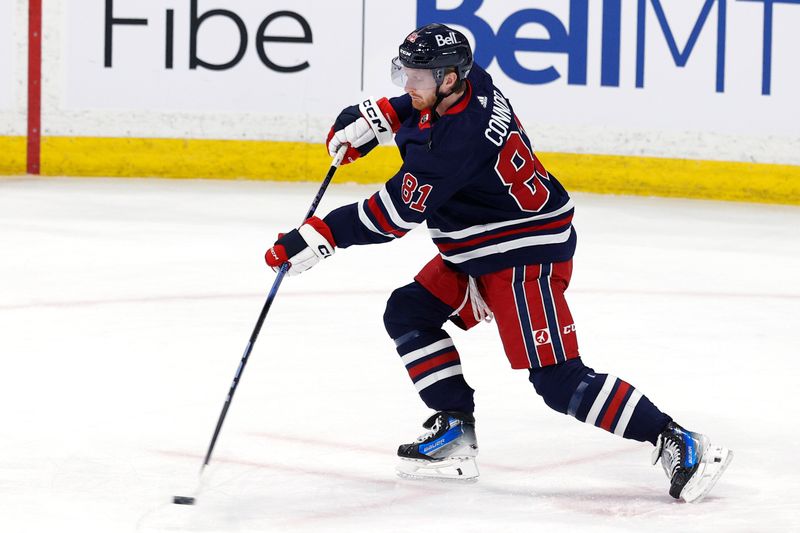 Mar 26, 2024; Winnipeg, Manitoba, CAN; Winnipeg Jets left wing Kyle Connor (81) warms up before a game against the Edmonton Oilers at Canada Life Centre. Mandatory Credit: James Carey Lauder-USA TODAY Sports