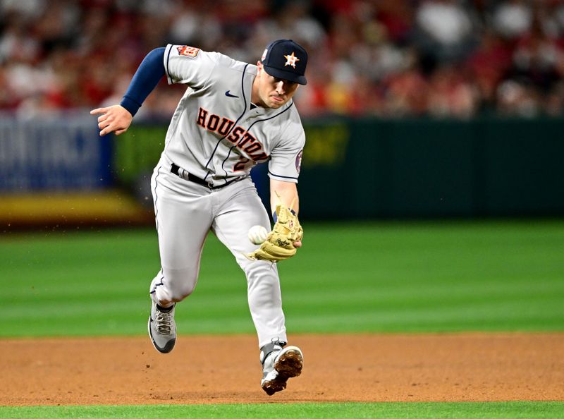 Apr 7, 2022; Anaheim, California, USA; Houston Astros third baseman Alex Bregman (2) field a ball and throws out Los Angeles Angels catcher Max Stassi (not pictured) at first in the fifth inning at Angel Stadium. Mandatory Credit: Jayne Kamin-Oncea-USA TODAY Sports