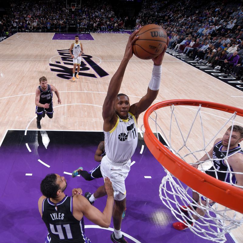 SACRAMENTO, CA - MARCH 31: Kris Dunn #11 of the Utah Jazz dunks the ball during the game against the Sacramento Kings on March 31, 2024 at Golden 1 Center in Sacramento, California. NOTE TO USER: User expressly acknowledges and agrees that, by downloading and or using this Photograph, user is consenting to the terms and conditions of the Getty Images License Agreement. Mandatory Copyright Notice: Copyright 2024 NBAE (Photo by Rocky Widner/NBAE via Getty Images)