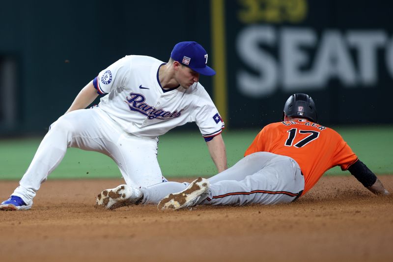 Jul 20, 2024; Arlington, Texas, USA; Baltimore Orioles left fielder Colton Cowser (17) steals second base against Texas Rangers shortstop Corey Seager (5) applies the tag in the sixth inning at Globe Life Field. Mandatory Credit: Tim Heitman-USA TODAY Sports