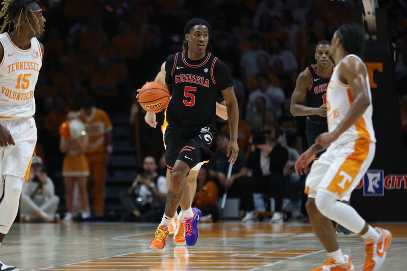 Jan 15, 2025; Knoxville, Tennessee, USA; Georgia Bulldogs guard Silas Demary Jr. (5) dribbles against the Tennessee Volunteers during the second half at Thompson-Boling Arena at Food City Center. Mandatory Credit: Randy Sartin-Imagn Images