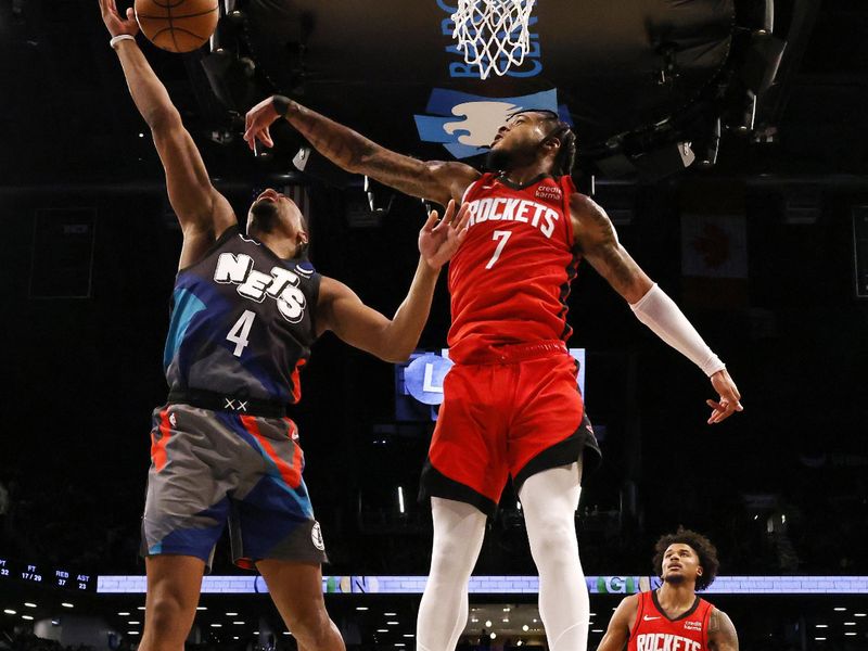 NEW YORK, NEW YORK - JANUARY 27:  Cam Whitmore #7 of the Houston Rockets blocks the shot of Dennis Smith Jr. #4 of the Brooklyn Nets during their game at Barclays Center on January 27, 2024 in New York City.  User expressly acknowledges and agrees that, by downloading and or using this photograph, User is consenting to the terms and conditions of the Getty Images License Agreement.   (Photo by Al Bello/Getty Images)