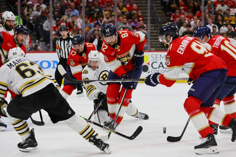 May 6, 2024; Sunrise, Florida, USA; Florida Panthers center Kevin Stenlund (82) clears the puck against the Boston Bruins during the first period in game one of the second round of the 2024 Stanley Cup Playoffs at Amerant Bank Arena. Mandatory Credit: Sam Navarro-USA TODAY Sports