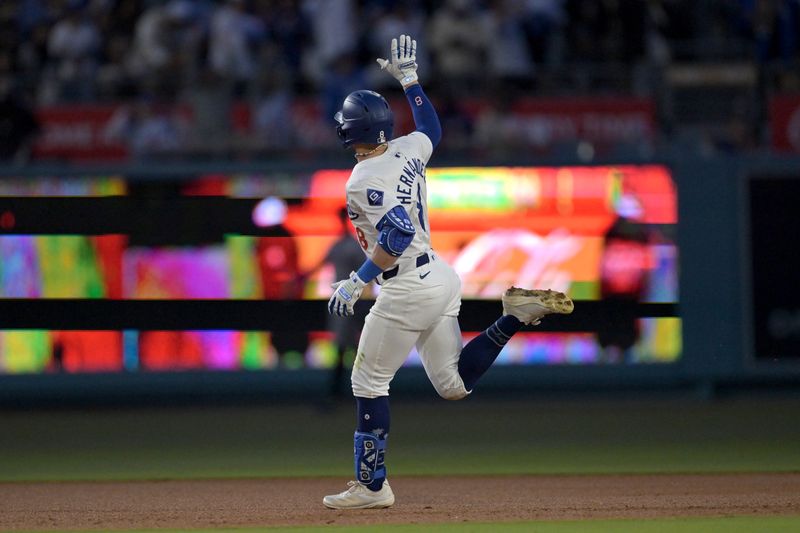 May 20, 2024; Los Angeles, California, USA;  Los Angeles Dodgers third baseman Kiki Hernandez (8) rounds the bases on a solo home run in the third inning against the Arizona Diamondbacks at Dodger Stadium. Mandatory Credit: Jayne Kamin-Oncea-USA TODAY Sports