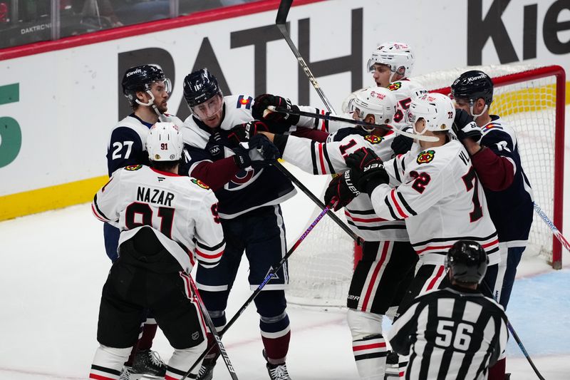 Mar 10, 2025; Denver, Colorado, USA; Chicago Blackhawks left wing Nick Foligno (17) and Colorado Avalanche center Brock Nelson (11) fight in the third period at Ball Arena. Mandatory Credit: Ron Chenoy-Imagn Images