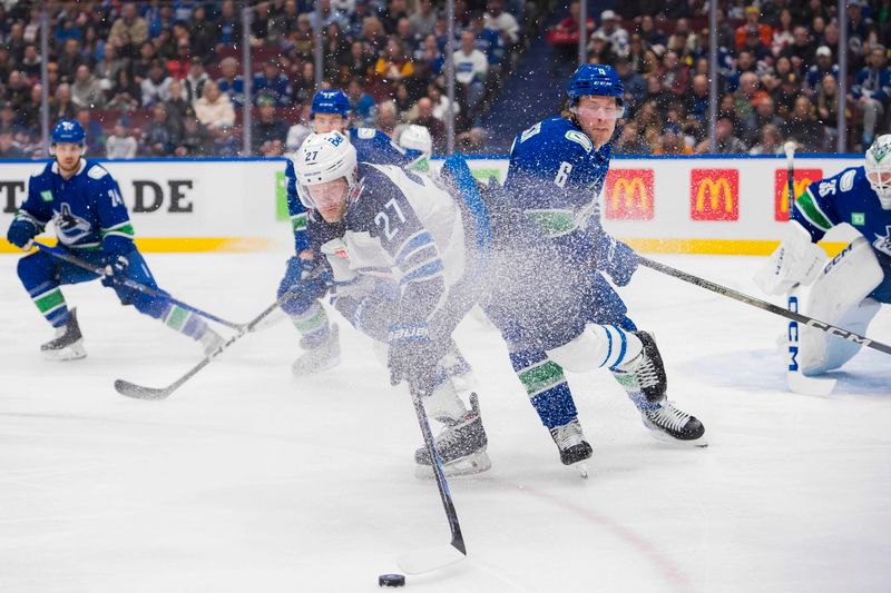 Feb 17, 2024; Vancouver, British Columbia, CAN; Vancouver Canucks forward Brock Boeser (6) checks Winnipeg Jets forward Nikolaj Ehlers (27) in the first period at Rogers Arena. Mandatory Credit: Bob Frid-USA TODAY Sports