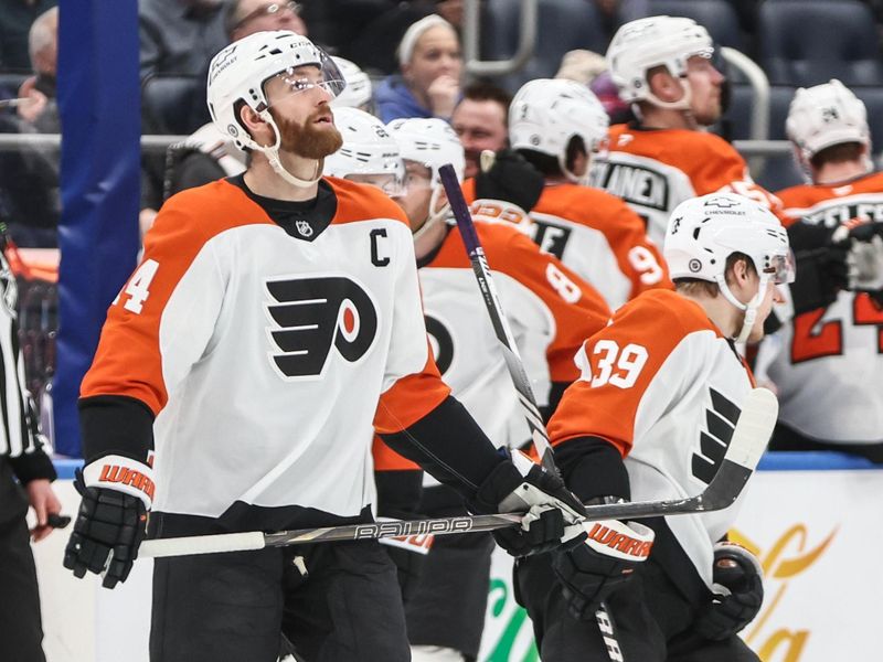 Jan 16, 2025; Elmont, New York, USA;  Philadelphia Flyers center Sean Couturier (14) looks up at the scoreboard after scoring a goal in the second period against the New York Islanders at UBS Arena. Mandatory Credit: Wendell Cruz-Imagn Images