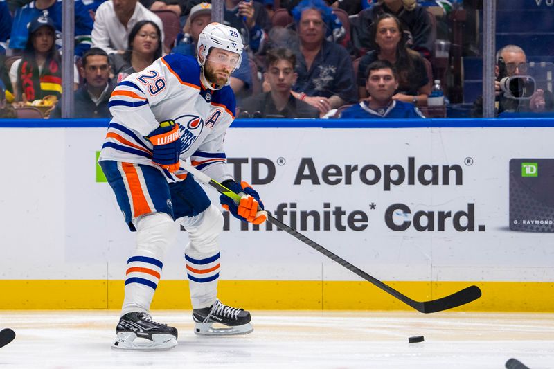 May 10, 2024; Vancouver, British Columbia, CAN; Edmonton Oilers forward Leon Draisaitl (29) handles the puck against the Vancouver Canucks during the second period in game two of the second round of the 2024 Stanley Cup Playoffs at Rogers Arena. Mandatory Credit: Bob Frid-USA TODAY Sports