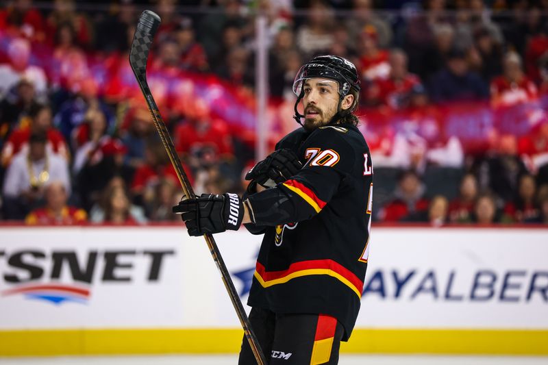 Dec 31, 2024; Calgary, Alberta, CAN; Calgary Flames left wing Ryan Lomberg (70) against the Vancouver Canucks during the second period at Scotiabank Saddledome. Mandatory Credit: Sergei Belski-Imagn Images