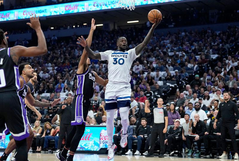 SACRAMENTO, CALIFORNIA - OCTOBER 24: Julius Randle #30 of the Minnesota Timberwolves shoots over Keegan Murray #13 of the Sacramento Kings in the first quarter at Golden 1 Center on October 24, 2024 in Sacramento, California. NOTE TO USER: User expressly acknowledges and agrees that, by downloading and or using this photograph, User is consenting to the terms and conditions of the Getty Images License Agreement. (Photo by Thearon W. Henderson/Getty Images)