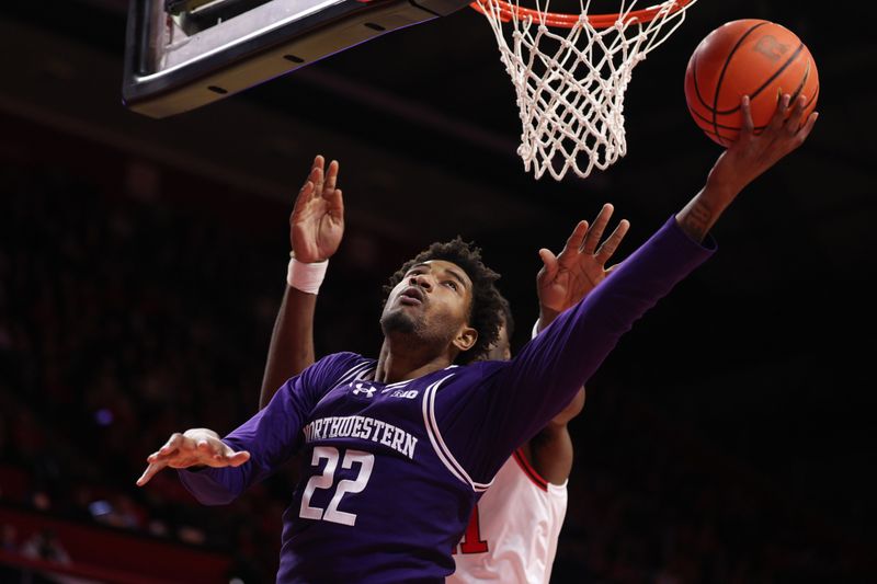 Jan 11, 2026; Piscataway, New Jersey, USA; Northwestern Wildcats forward Arrinten Page (22) goes to the basket during the first half against the Rutgers Scarlet Knights at Jersey Mike's Arena. Mandatory Credit: Vincent Carchietta-Imagn Images