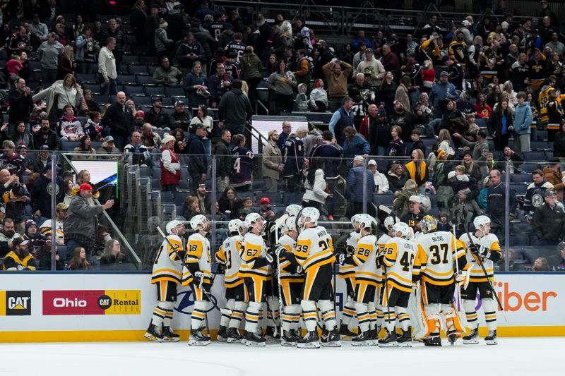 Jan 4, 2026; Columbus, Ohio, USA;  Pittsburgh Penguins center Sidney Crosby (87) celebrates with teammates after scoring the game-winning goal against the Columbus Blue Jackets in the overtime period at Nationwide Arena. Mandatory Credit: Aaron Doster-Imagn Images
