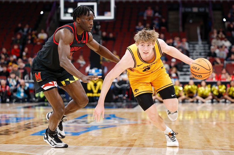Mar 11, 2026; Chicago, IL, USA; Iowa Hawkeyes forward Cooper Koch (8) drives to the basket against Maryland Terrapins guard George Turkson Jr. (11) during the second half at United Center. Mandatory Credit: Kamil Krzaczynski-Imagn Images