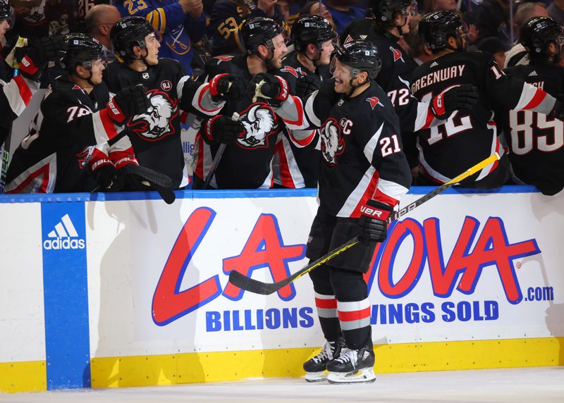 Mar 2, 2024; Buffalo, New York, USA;  Buffalo Sabres right wing Kyle Okposo (21) celebrates his goal with teammates during the third period against the Vegas Golden Knights at KeyBank Center. Mandatory Credit: Timothy T. Ludwig-USA TODAY Sports