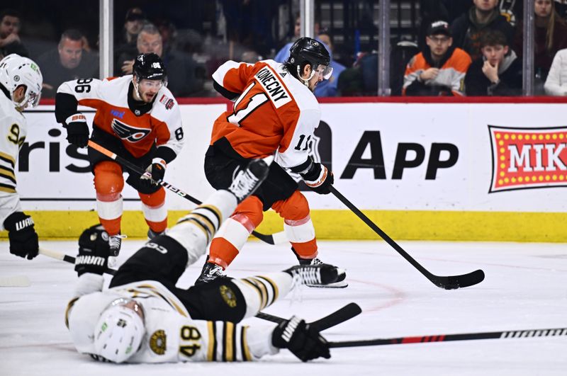 Jan 27, 2024; Philadelphia, Pennsylvania, USA; Philadelphia Flyers right wing Travis Konecny (11) controls the puck against the Boston Bruins in the second period at Wells Fargo Center. Mandatory Credit: Kyle Ross-USA TODAY Sports