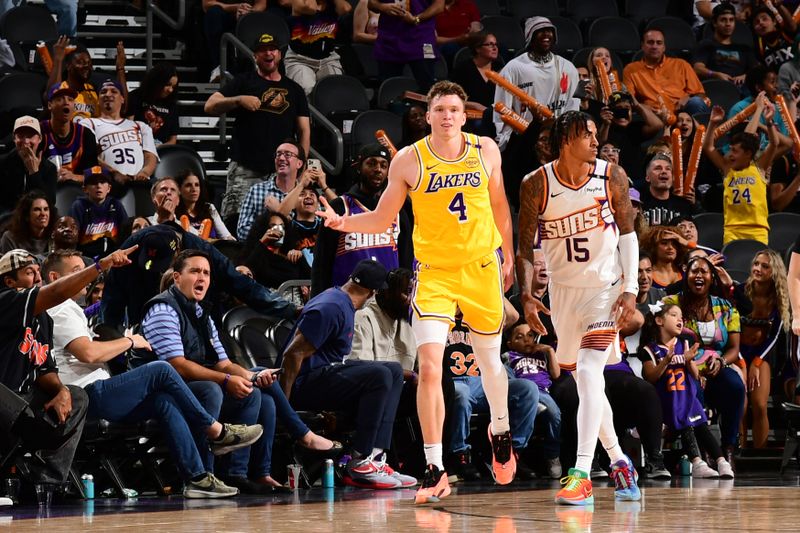 PHOENIX, AZ - OCTOBER 17: Dalton Knecht #4 of the Los Angeles Lakers celebrates the forth quarter, game tying three point basket during the game against the Phoenix Suns on October 17, 2024 at Footprint Center in Phoenix, Arizona. NOTE TO USER: User expressly acknowledges and agrees that, by downloading and or using this photograph, user is consenting to the terms and conditions of the Getty Images License Agreement. Mandatory Copyright Notice: Copyright 2024 NBAE (Photo by Kate Frese/NBAE via Getty Images)