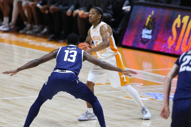 Dec 12, 2023; Knoxville, Tennessee, USA; Tennessee Volunteers guard Zakai Zeigler (5) passes the ball against Georgia Southern Eagles guard Eren Banks (13) at Food City Center at Thompson-Boling Arena. Mandatory Credit: Randy Sartin-USA TODAY Sports