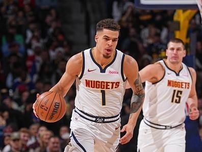 DENVER, CO - DECEMBER 25: Michael Porter Jr. #1 of the Denver Nuggets brings the ball up court against the Golden State Warriors on December 25, 2023 at the Ball Arena in Denver, Colorado. NOTE TO USER: User expressly acknowledges and agrees that, by downloading and/or using this Photograph, user is consenting to the terms and conditions of the Getty Images License Agreement. Mandatory Copyright Notice: Copyright 2023 NBAE (Photo by Bart Young/NBAE via Getty Images)