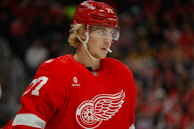 Jan 3, 2026; Detroit, Michigan, USA; Detroit Red Wings defenseman Simon Edvinsson (77) looks on during the first period against the Pittsburgh Penguins at Little Caesars Arena. Mandatory Credit: Brian Bradshaw Sevald-Imagn Images