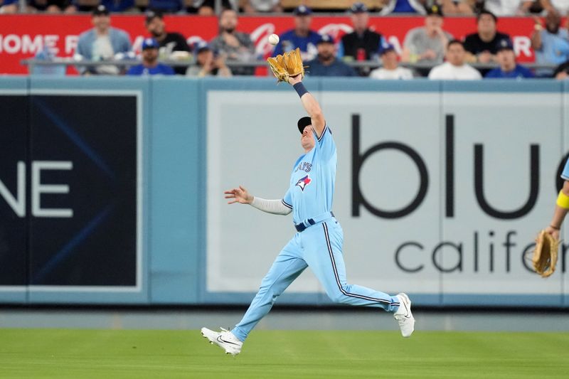 Jul 25, 2023; Los Angeles, California, USA; Toronto Blue Jays right fielder Jordan Luplow (7) catches the ball in the third inning against the Los Angeles Dodgers at Dodger Stadium. Mandatory Credit: Kirby Lee-USA TODAY Sports