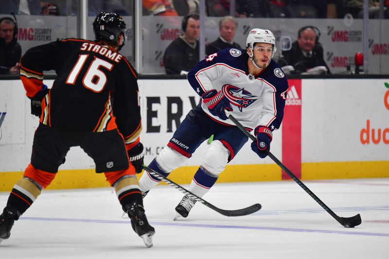 Feb 21, 2024; Anaheim, California, USA; Columbus Blue Jackets center Cole Sillinger (4) moves the puck against Anaheim Ducks center Ryan Strome (16) during the second period at Honda Center. Mandatory Credit: Gary A. Vasquez-USA TODAY Sports