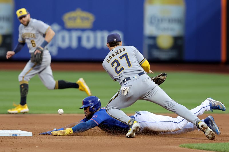 Jun 26, 2023; New York City, New York, USA; New York Mets right fielder Starling Marte (6) steals second base as the throw gets by Milwaukee Brewers shortstop Willy Adames (27) allowing Marte to advance to third during the fourth inning at Citi Field. Mandatory Credit: Brad Penner-USA TODAY Sports