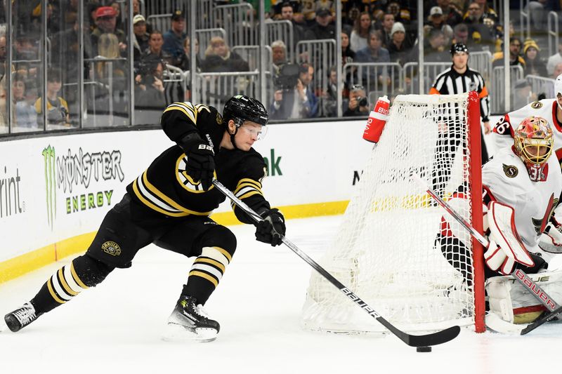 Apr 16, 2024; Boston, Massachusetts, USA;  Boston Bruins center Trent Frederic (11) tries to wrap the puck behind Ottawa Senators goaltender Anton Forsberg (31) during the third period at TD Garden. Mandatory Credit: Bob DeChiara-USA TODAY Sports