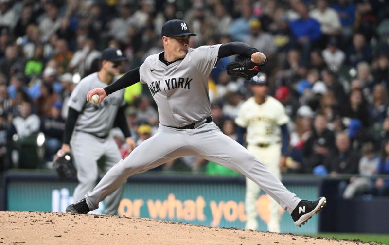 Apr 26, 2024; Milwaukee, Wisconsin, USA; New York Yankees pitcher Ron Marinaccio (97) delivers a pitch against the Milwaukee Brewers in the sixth inning at American Family Field. Mandatory Credit: Michael McLoone-USA TODAY Sports