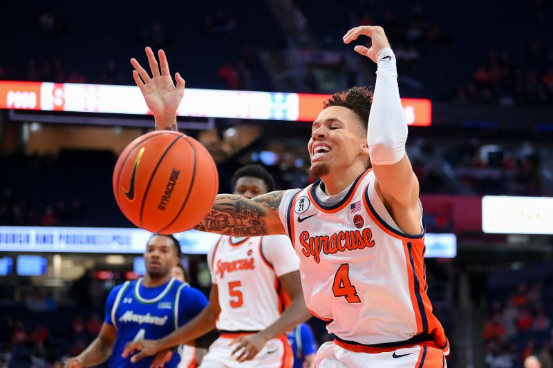 Dec 17, 2025; Syracuse, New York, USA; Syracuse Orange guard Nate Kingz (4) loses control of the ball on a drive against the Mercyhurst Lakers during the second half at the JMA Wireless Dome. Mandatory Credit: Rich Barnes-Imagn Images