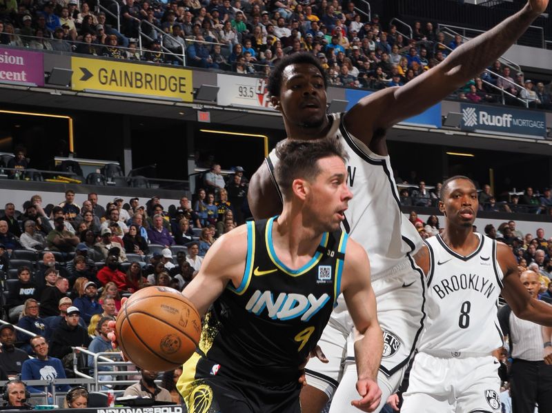 INDIANAPOLIS, IN - MARCH 16: T.J. McConnell #9 of the Indiana Pacers handles the ball during the game against the Brooklyn Nets on March 16, 2024 at Gainbridge Fieldhouse in Indianapolis, Indiana. NOTE TO USER: User expressly acknowledges and agrees that, by downloading and or using this Photograph, user is consenting to the terms and conditions of the Getty Images License Agreement. Mandatory Copyright Notice: Copyright 2024 NBAE (Photo by Ron Hoskins/NBAE via Getty Images)