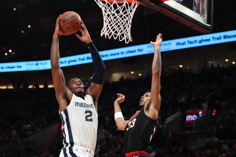 PORTLAND, OREGON - NOVEMBER 03: Xavier Tillman #2 of the Memphis Grizzlies drives to the basket past Toumani Camara #33 of the Portland Trail Blazers in the second quarter during the NBA In-Season Tournament at Moda Center on November 03, 2023 in Portland, Oregon. NOTE TO USER: User expressly acknowledges and agrees that, by downloading and or using this photograph, User is consenting to the terms and conditions of the Getty Images License Agreement.? (Photo by Amanda Loman/Getty Images)