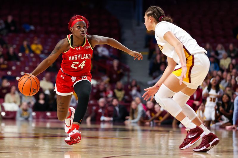 Jan 3, 2024; Minneapolis, Minnesota, USA; Maryland Terrapins guard Bri McDaniel (24) works around Minnesota Golden Gophers guard Amaya Battle (3) during the second half at Williams Arena. Mandatory Credit: Matt Krohn-USA TODAY Sports