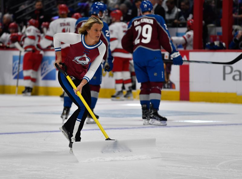 Oct 21, 2023; Denver, Colorado, USA; Colorado Avalanche Ice Patrol clear the ice during a break in the action during the Colorado Avalanche and Carolina Hurricanes game at Ball Arena. Mandatory Credit: John Leyba-USA TODAY Sports