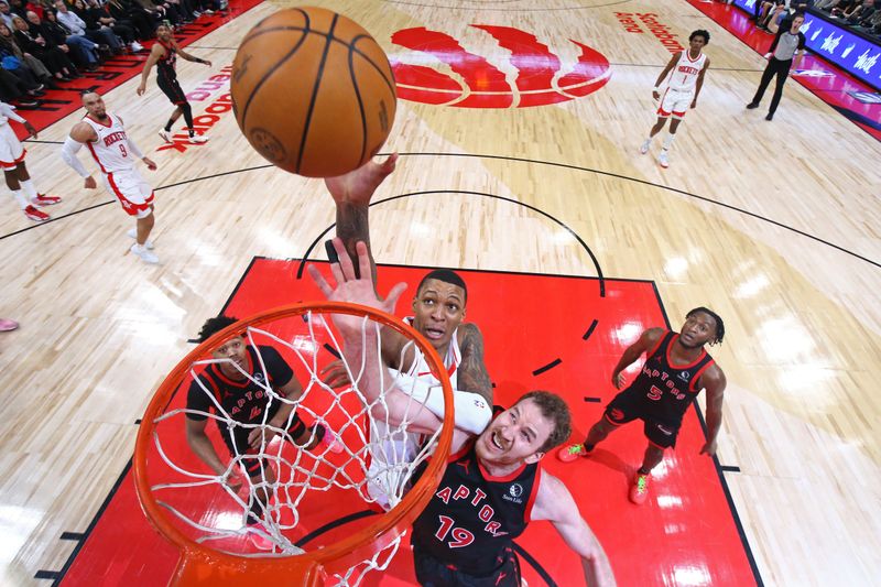 TORONTO, CANADA - FEBRUARY 9: Jabari Smith Jr. #10 of the Houston Rockets rebounds during the game against the Toronto Raptors on February 9, 2024 at the Scotiabank Arena in Toronto, Ontario, Canada.  NOTE TO USER: User expressly acknowledges and agrees that, by downloading and or using this Photograph, user is consenting to the terms and conditions of the Getty Images License Agreement.  Mandatory Copyright Notice: Copyright 2024 NBAE (Photo by Vaughn Ridley/NBAE via Getty Images)