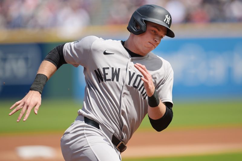 Apr 23, 2025; Cleveland, Ohio, USA; New York Yankees first baseman Ben Rice (22) rounds third base en route to scoring on a triple hit by right fielder Aaron Judge (not pictured) during the first inning against the Cleveland Guardians at Progressive Field. Mandatory Credit: Ken Blaze-Imagn Images