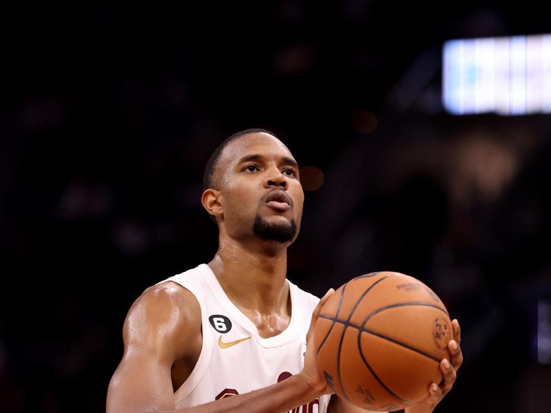 CLEVELAND, OH - MARCH 31: Evan Mobley #4 of the Cleveland Cavaliers prepares to shoot a free throw against the New York Knicks  on March 31, 2023 at Rocket Mortgage FieldHouse in Cleveland, Ohio. NOTE TO USER: User expressly acknowledges and agrees that, by downloading and/or using this Photograph, user is consenting to the terms and conditions of the Getty Images License Agreement. Mandatory Copyright Notice: Copyright 2023 NBAE (Photo by  Lauren Leigh Bacho/NBAE via Getty Images)