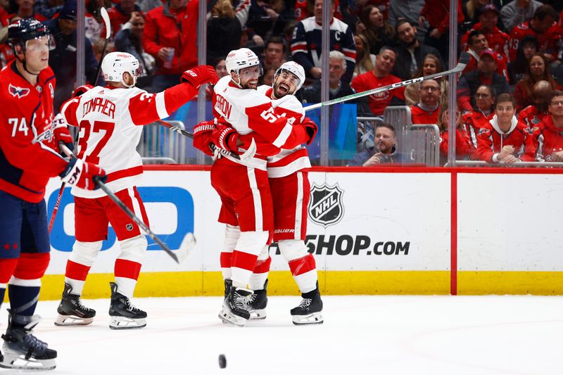 Mar 26, 2024; Washington, District of Columbia, USA; Detroit Red Wings left wing David Perron (57) celebrates with teammates after scoring a goal against the Washington Capitals during the second period at Capital One Arena. Mandatory Credit: Amber Searls-USA TODAY Sports