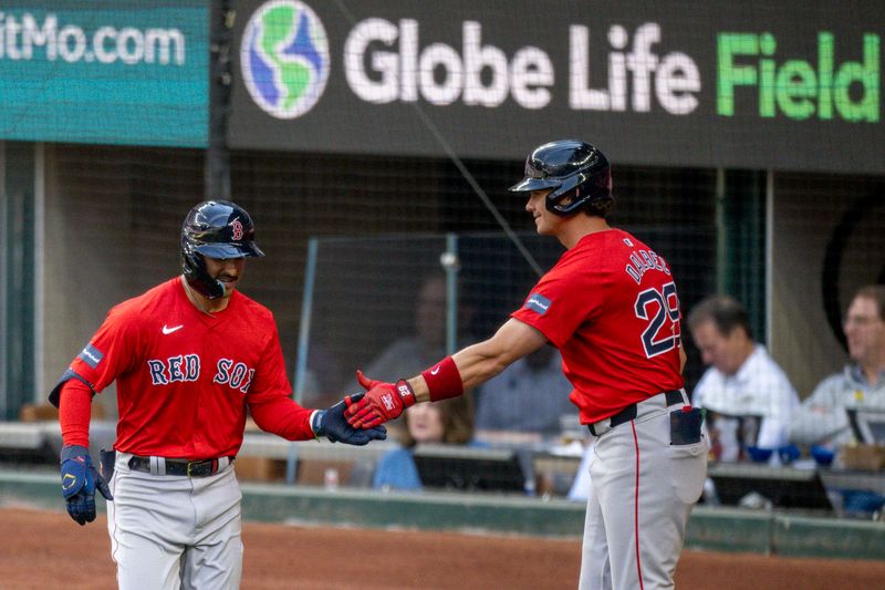 Mar 26, 2024; Arlington, Texas, USA; Boston Red Sox first baseman Bobby Dalbec (29) and center fielder Mark Contreras (59) celebrate after Contreras hits a home run against the Texas Rangers at Globe Life Field. Mandatory Credit: Jerome Miron-USA TODAY Sports