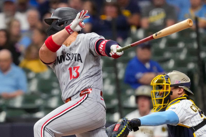May 16, 2025; Milwaukee, Wisconsin, USA;  Minnesota Twins first baseman Ty France (13) hits an RBI single during the first inning against the Milwaukee Brewers at American Family Field. Mandatory Credit: Jeff Hanisch-Imagn Images