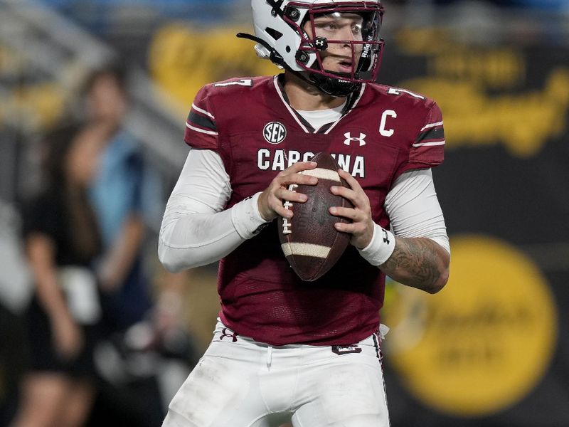 Sep 2, 2023; Charlotte, North Carolina, USA; South Carolina Gamecocks quarterback Spencer Rattler (7) looks for a receiver during the second half against the North Carolina Tar Heels at Bank of America Stadium. Mandatory Credit: Jim Dedmon-USA TODAY Sports