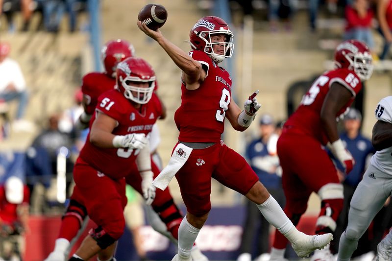 Oct 23, 2021; Fresno, California, USA; Fresno State Bulldogs quarterback Jake Haener (9) throws a pass against the Nevada Wolf Pack in the first quarter at Bulldog Stadium. Mandatory Credit: Cary Edmondson-USA TODAY Sports