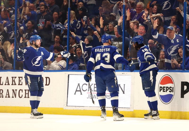 Mar 14, 2024; Tampa, Florida, USA; Tampa Bay Lightning left wing Anthony Duclair (10) is congratulated by teammates after he scored a goal against the New York Rangers  during the second period at Amalie Arena. Mandatory Credit: Kim Klement Neitzel-USA TODAY Sports