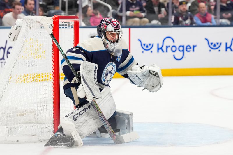 Feb 28, 2026; Columbus, Ohio, USA;  Columbus Blue Jackets goaltender Jet Greaves (73) defends the net against the New York Islanders in the first period at Nationwide Arena. Mandatory Credit: Aaron Doster-Imagn Images